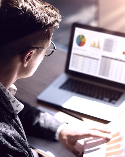 API Banking on computer screen that guy is looking at